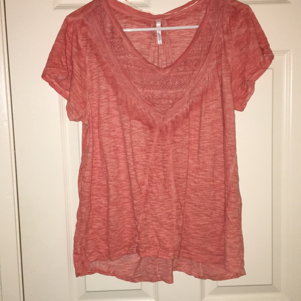 Pink shirt with textured design on the front